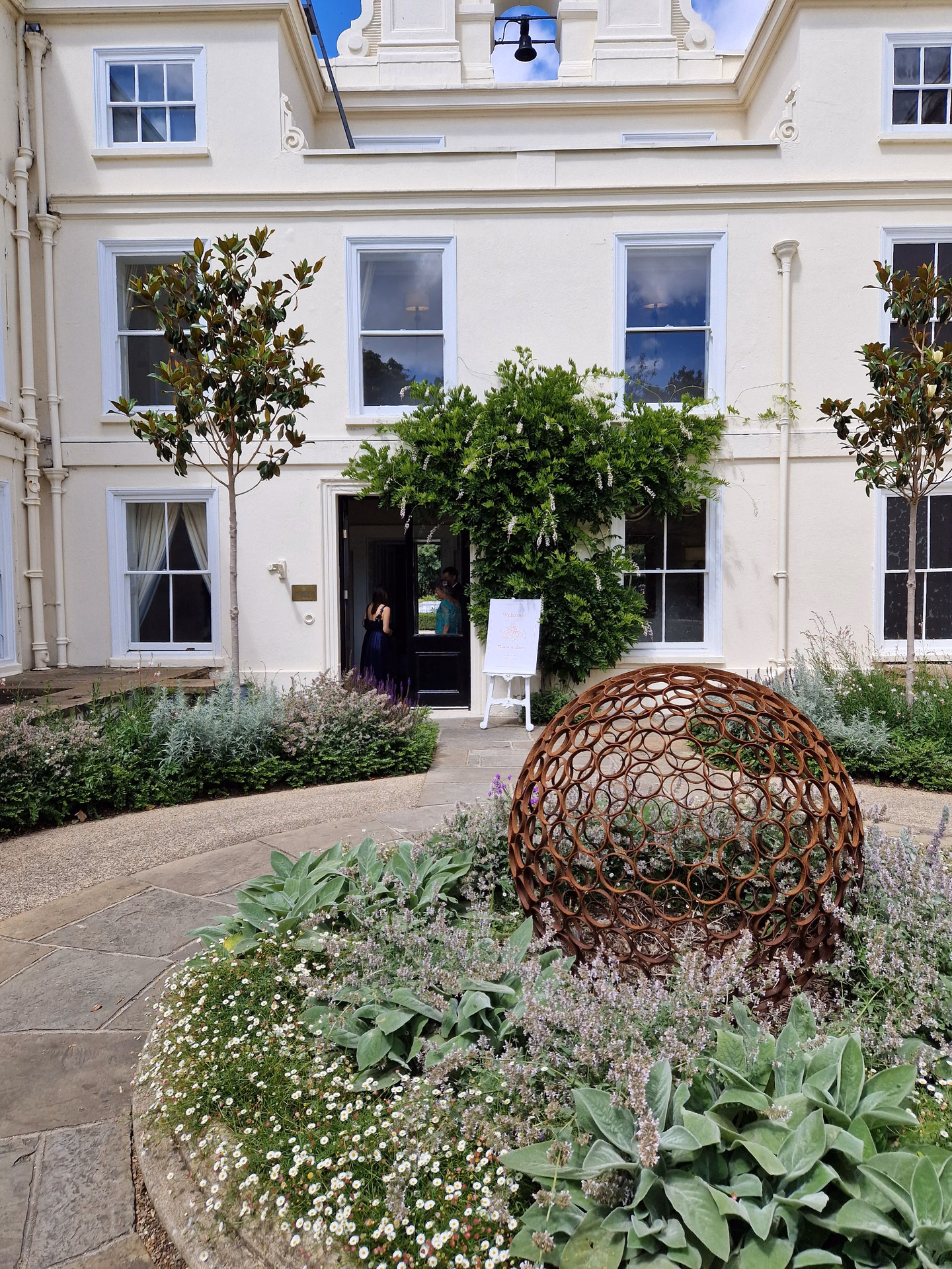 Exclusive boutique courtyard with stone arches, festoon lighting, and intimate evening dining